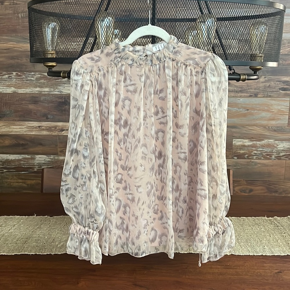 Beautiful shimmer soft pink feather motif top